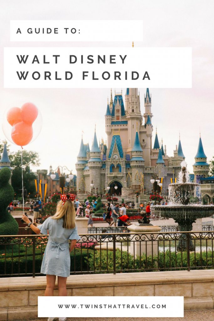 A girl stood with a balloon in front of Cinderella's Castle in the Magic Kingdom at Walt Disney World, Florida.